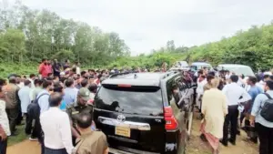 Car On Field People are Gathering