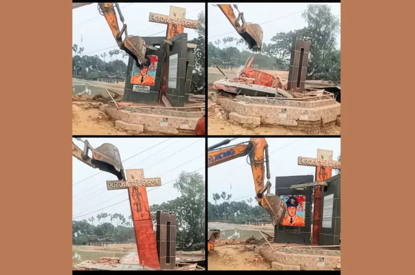 এক্সকাভেটর দিয়ে ভাস্কর্য অপসারণ করা হচ্ছে।