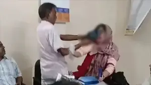 শিক্ষিকাকে জুতাপেটা করছেন বিএনপি নেতা শাহাদাত হোসেন।